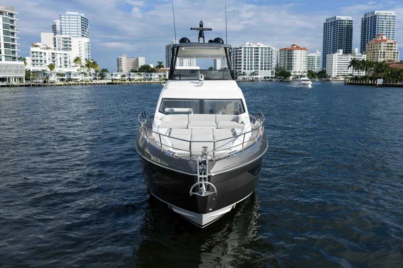 Next Play Yacht Photos Pics 2024 Azimut Fly 68 yacht on water with city skyline background.