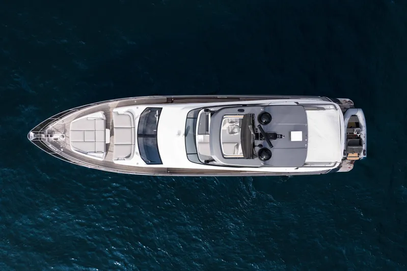 Next Play Yacht Photos Pics Top view of 2024 Azimut Fly 68 yacht on deep blue water.