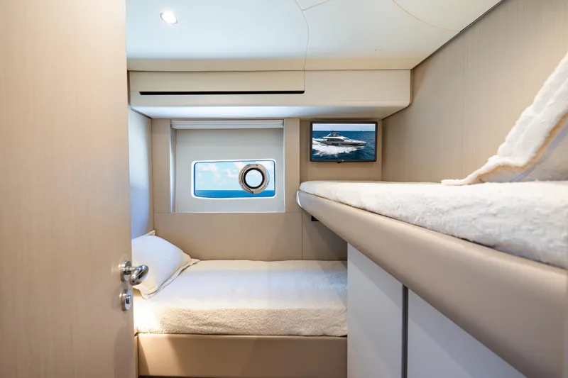 Next Play Yacht Photos Pics 2024 Azimut Fly 68 yacht cabin with cozy beds and ocean view.
