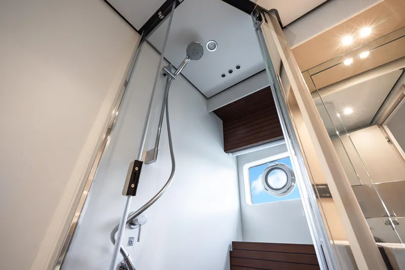 Next Play Yacht Photos Pics Luxurious shower in 2024 Azimut Fly 68 yacht, featuring modern fixtures and elegant design.