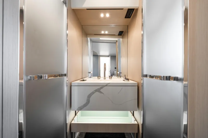 Next Play Yacht Photos Pics Luxurious bathroom interior of 2024 Azimut Fly 68 yacht, featuring modern design and elegant fixtures.