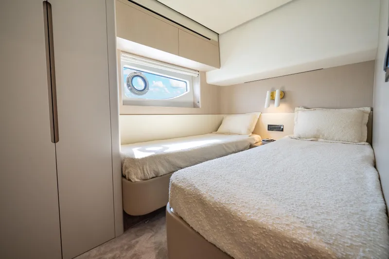 Next Play Yacht Photos Pics Luxurious twin bedroom in 2024 Azimut Fly 68 yacht, featuring modern design and natural light.