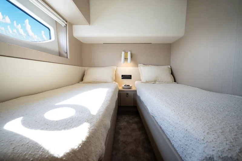 Next Play Yacht Photos Pics Interior of 2024 Azimut Fly 68 yacht with twin beds and window view.