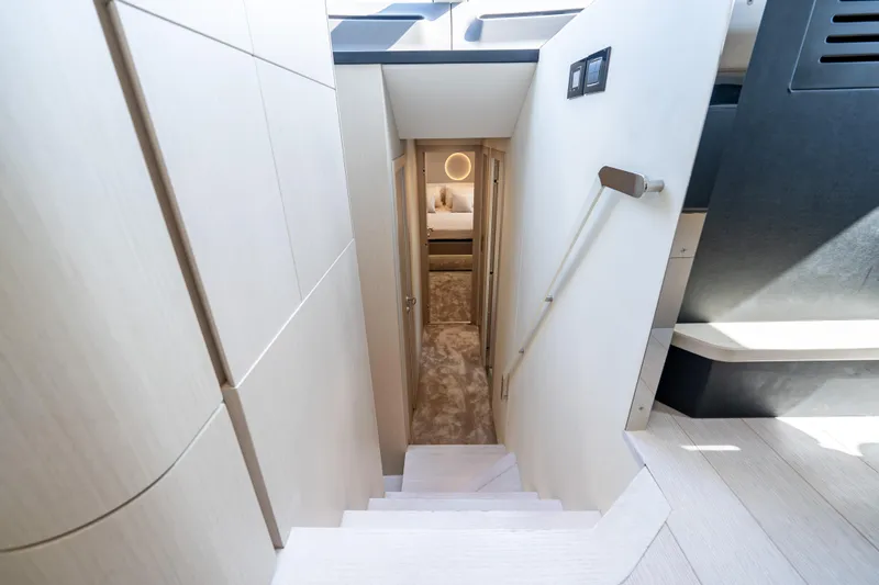 Next Play Yacht Photos Pics Stairway leading to a luxurious cabin in the 2024 Azimut Fly 68 yacht.