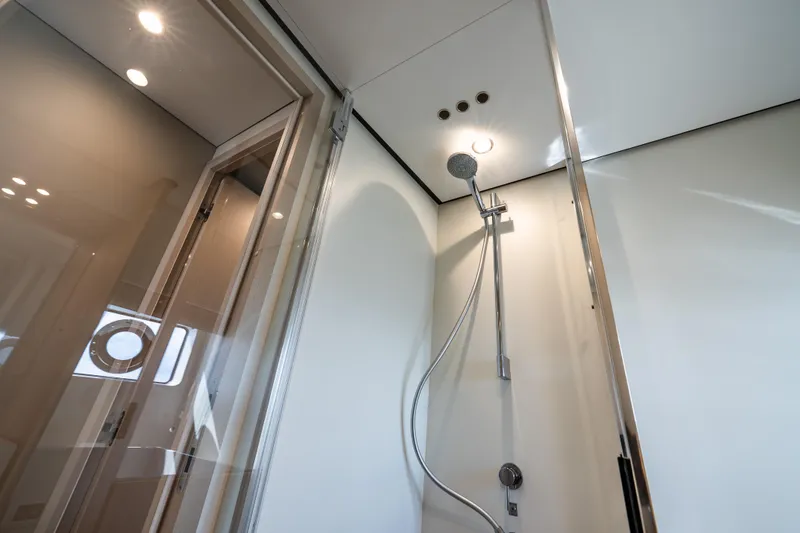 Next Play Yacht Photos Pics Luxurious shower in 2024 Azimut Fly 68 yacht, featuring modern fixtures and elegant design.
