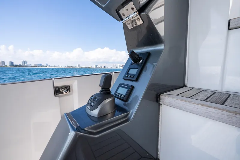 Next Play Yacht Photos Pics Control panel of 2024 Azimut Fly 68 yacht with ocean view.