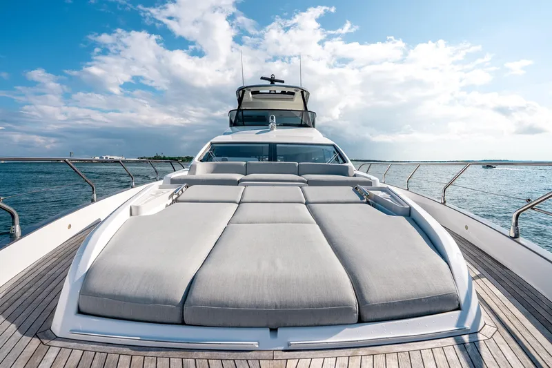 Next Play Yacht Photos Pics 2024 Azimut Fly 68 yacht with luxurious sunbathing deck on open sea.