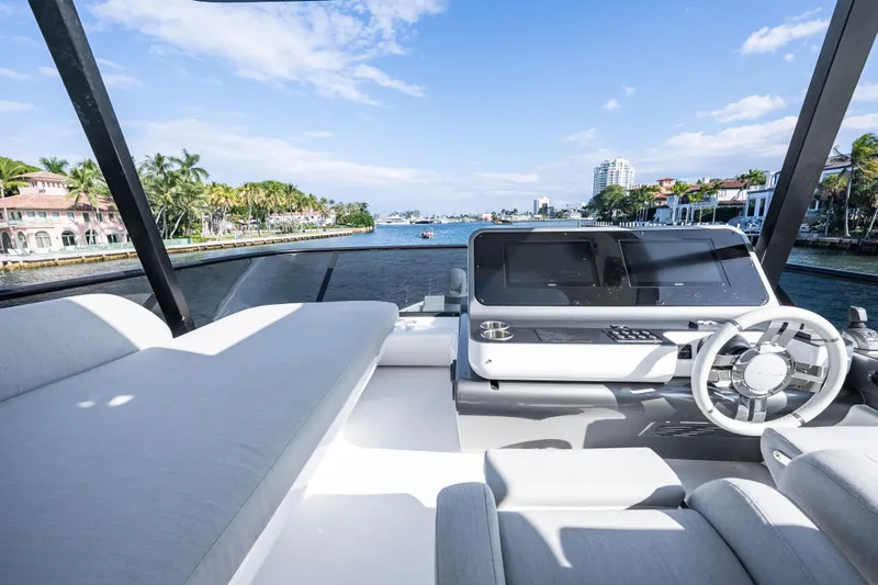 Next Play Yacht Photos Pics 2024 Azimut Fly 68 yacht helm with luxurious seating and waterfront view.