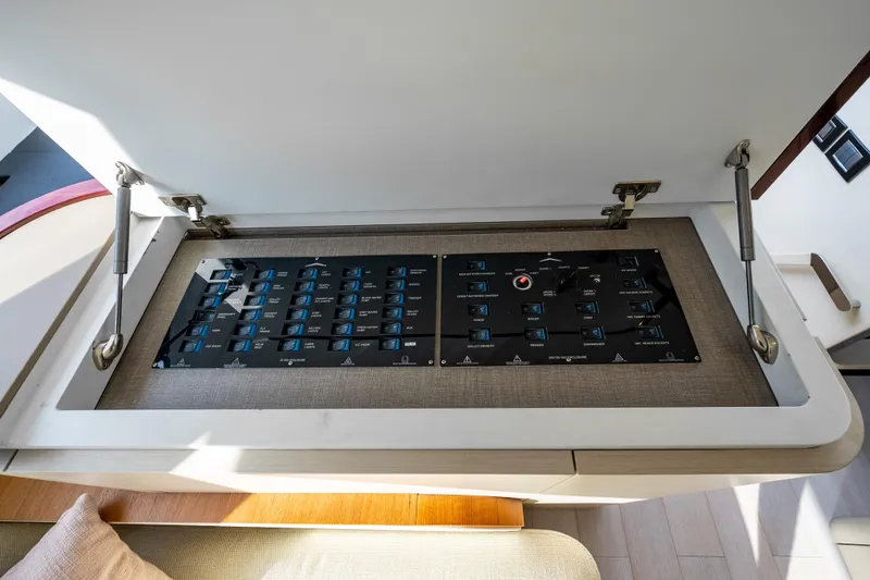 Next Play Yacht Photos Pics Control panel of 2024 Azimut Fly 68 yacht, featuring modern switches and sleek design.
