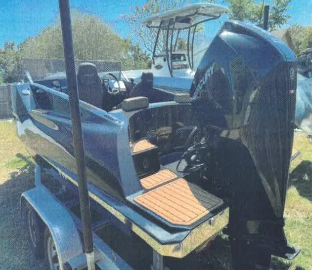  Yacht Photos Pics 2024 D-Boat 22 Diamond Series on trailer, featuring sleek design and powerful Mercury engine.