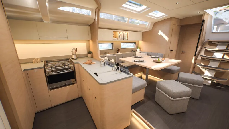  Yacht Photos Pics Luxurious interior of 2025 Dufour 54 yacht with modern kitchen and dining area.