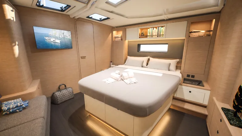  Yacht Photos Pics Luxurious cabin interior of 2025 Dufour 54 yacht with modern design and ambient lighting.