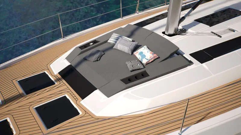  Yacht Photos Pics Luxurious 2025 Dufour 54 yacht deck with cushions and sleek design.