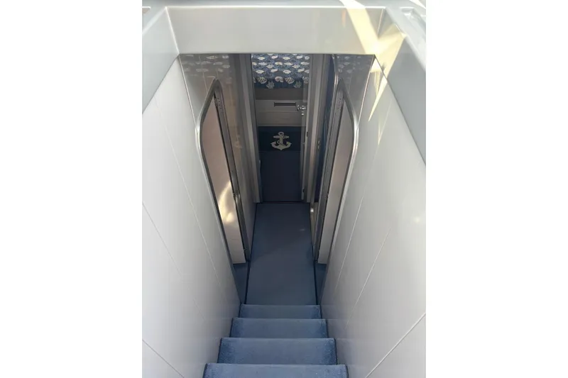  Yacht Photos Pics Stairway leading to cabin interior of 1992 Mochi Craft 46 yacht.