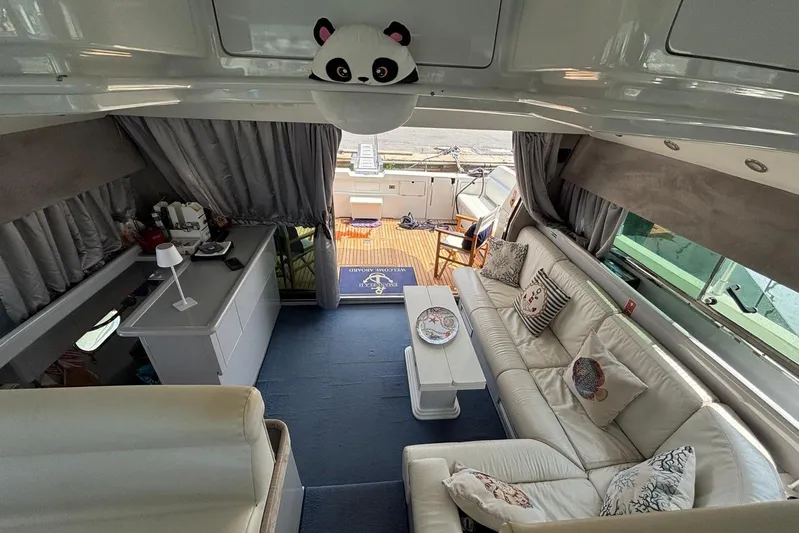  Yacht Photos Pics Luxurious interior of a 1992 Mochi Craft 46 yacht with elegant seating and decor.