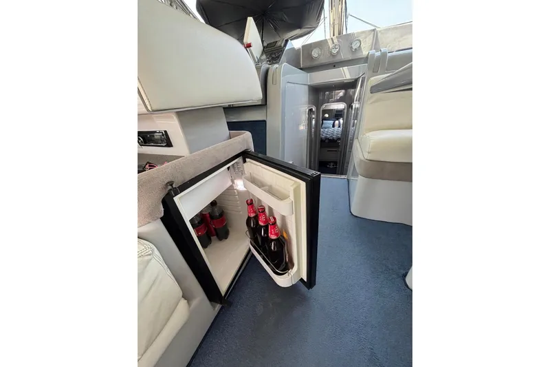  Yacht Photos Pics Interior of 1992 Mochi Craft 46 yacht with open mini fridge and drinks.