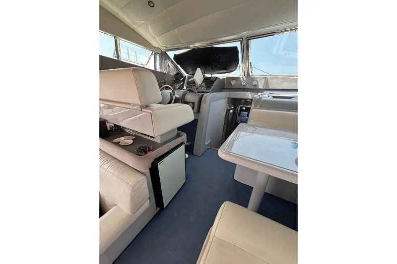  Yacht Photos Pics Interior of 1992 Mochi Craft 46 yacht with modern seating and navigation area.