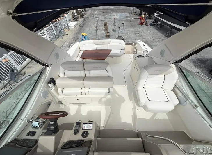  Yacht Photos Pics 2011 Sea Ray 350 Sundancer boat interior with seating and control panel.