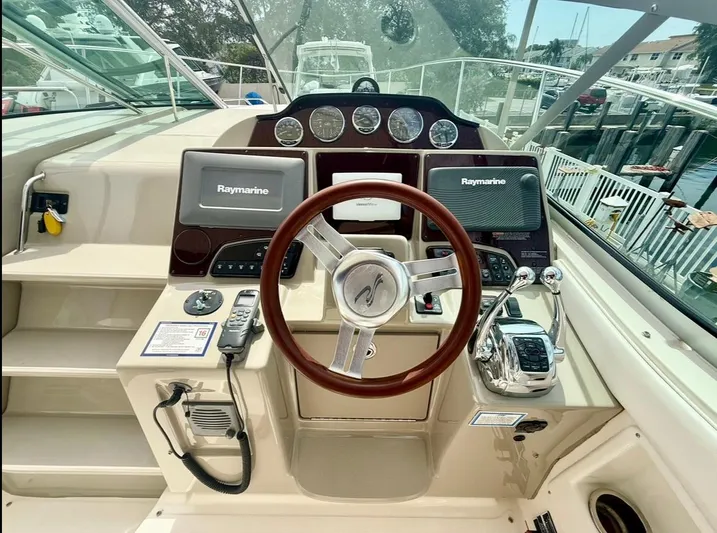  Yacht Photos Pics 2011 Sea Ray 350 Sundancer helm with Raymarine electronics and polished steering wheel.