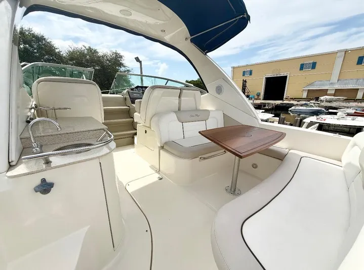  Yacht Photos Pics 2011 Sea Ray 350 Sundancer boat interior with seating, table, and kitchenette.