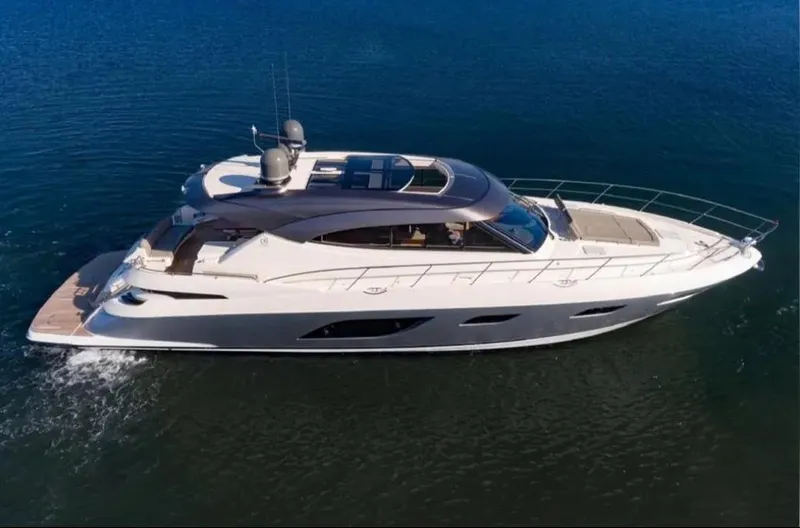  Yacht Photos Pics 2020 Riviera 6000 Motor Yacht cruising on open water.