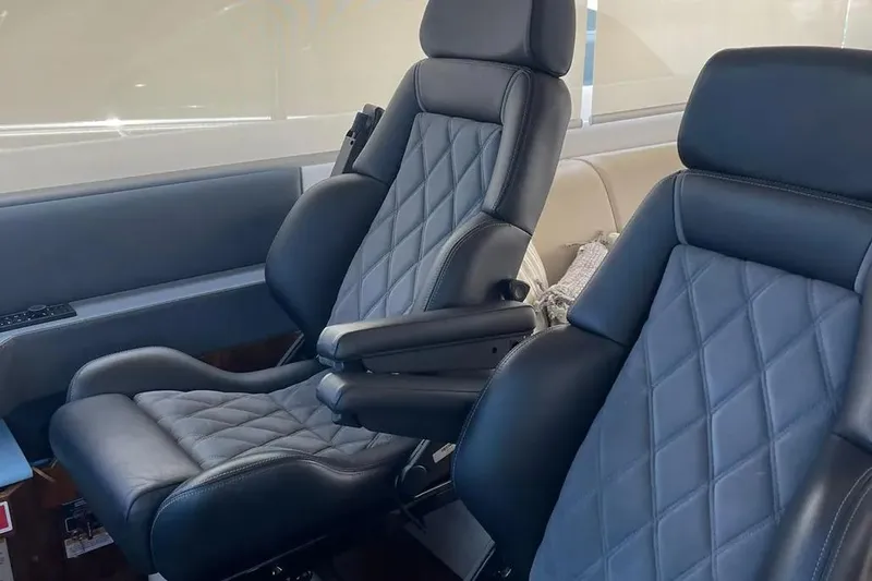  Yacht Photos Pics Luxurious leather seats in a 2020 Riviera 6000 Motor Yacht interior.