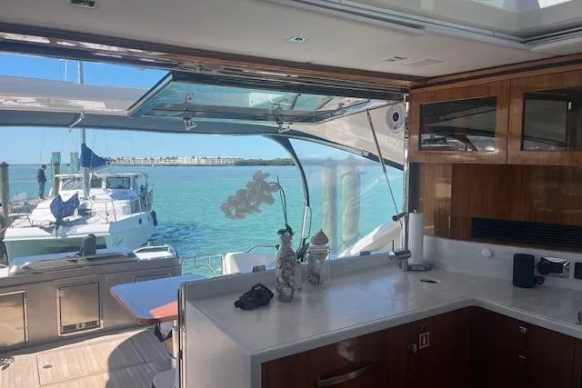  Yacht Photos Pics Luxurious interior of 2020 Riviera 6000 Sport Yacht Platinum Edition with ocean view.