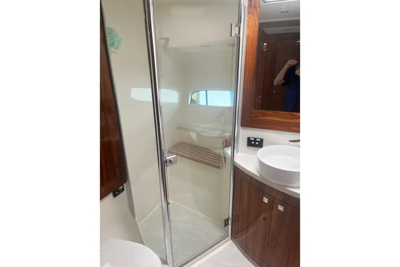  Yacht Photos Pics Luxurious bathroom in 2020 Riviera 6000 Sport Yacht Platinum Edition with modern fixtures.