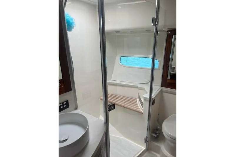  Yacht Photos Pics Luxurious bathroom in 2020 Riviera 6000 Sport Yacht Platinum Edition with modern fixtures.