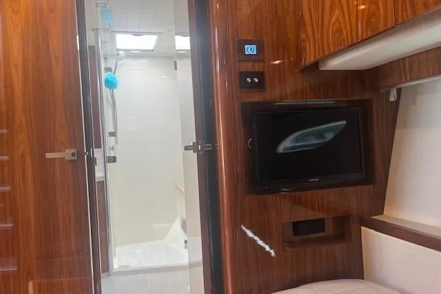  Yacht Photos Pics Interior of 2020 Riviera 6000 Sport Yacht Platinum Edition with wood paneling and modern amenities.