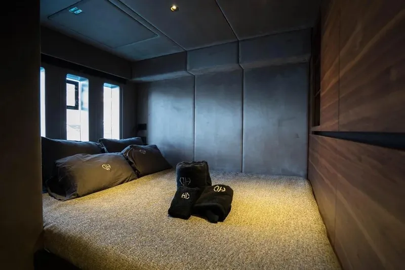  Yacht Photos Pics Luxurious bedroom interior of 2024 Sunreef 60 Power Eco yacht with elegant bedding.