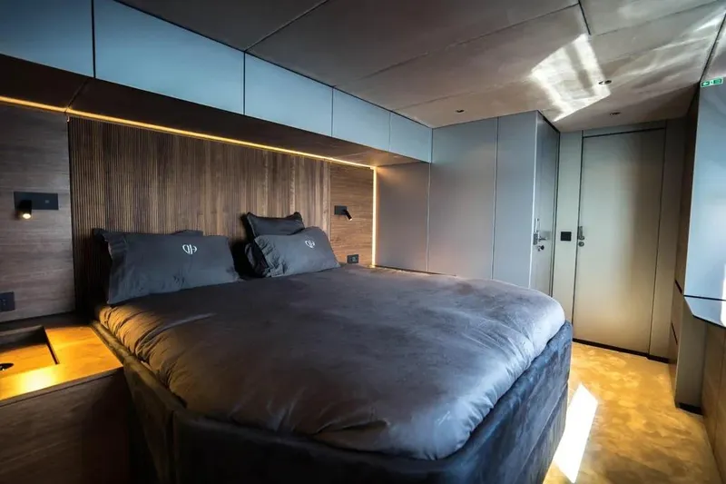  Yacht Photos Pics Luxurious bedroom interior of 2024 Sunreef 60 Power Eco yacht with modern design.