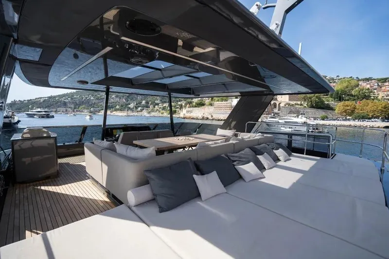  Yacht Photos Pics Luxurious Sunreef 60 Power Eco yacht deck with plush seating, overlooking scenic coastal waters.