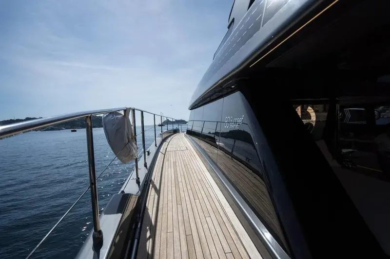  Yacht Photos Pics Luxurious 2024 Sunreef 60 Power Eco yacht deck with sleek design and ocean view.