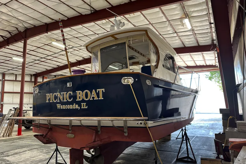 Picnic Boat Yacht Photos Pics 2003 Legacy Yachts 34 Express "Picnic Boat" in a warehouse, Wauconda, IL.