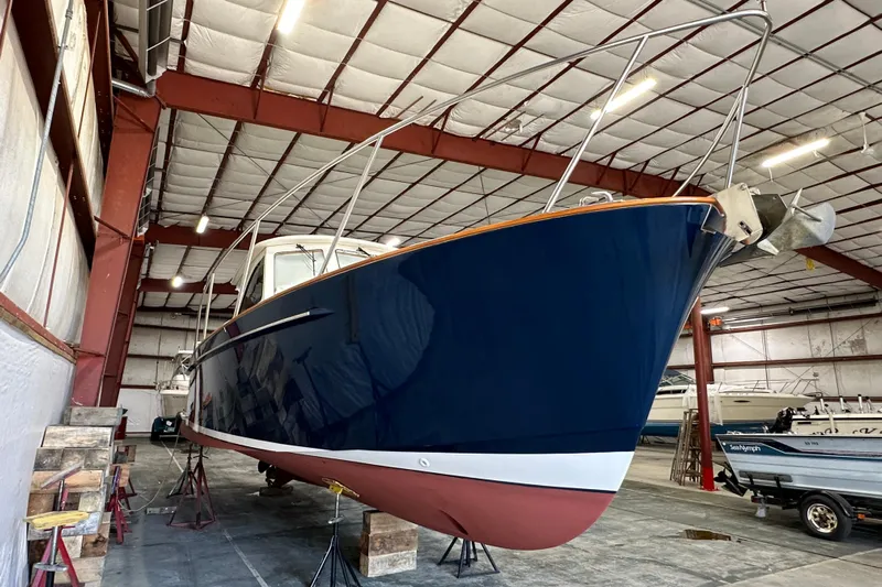 Picnic Boat Yacht Photos Pics 2003 Legacy Yachts 34 Express in a boat storage facility.