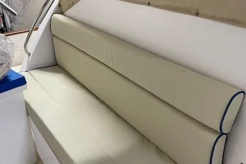 Picnic Boat Yacht Photos Pics 2003 Legacy Yachts 34 Express interior with beige cushioned seating.