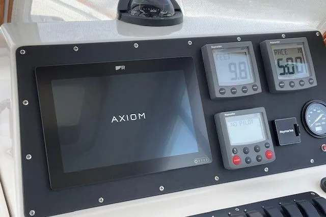 Picnic Boat Yacht Photos Pics Control panel of 2003 Legacy Yachts 34 Express with Axiom display and Raymarine instruments.