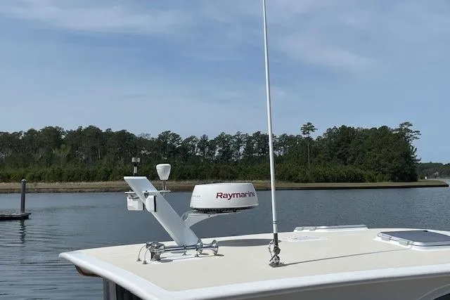 Picnic Boat Yacht Photos Pics 2003 Legacy Yachts 34 Express with Raymarine equipment on calm water.