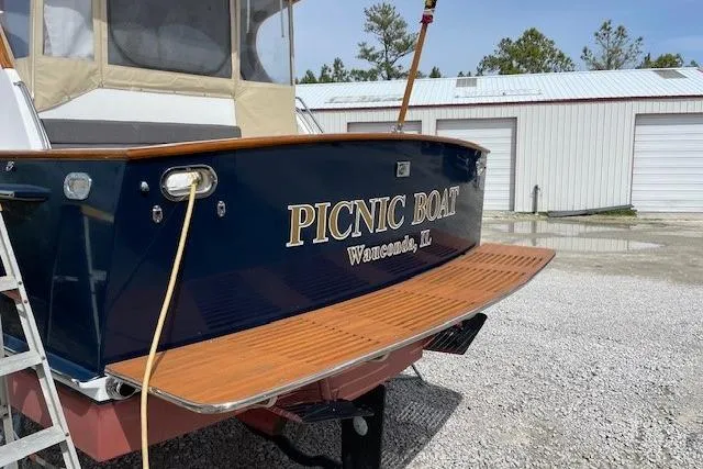 Picnic Boat Yacht Photos Pics 2003 Legacy Yachts 34 Express boat with "Picnic Boat" name, docked outdoors.
