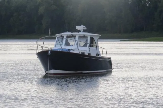 Picnic Boat Yacht Photos Pics 2003 Legacy Yachts 34 Express cruising on calm waters.