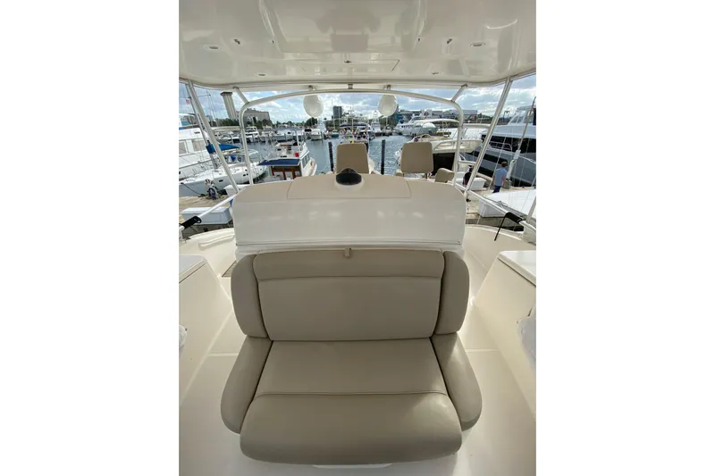Cometa Yacht Photos Pics 2012 Tiara Yachts 4800 Convertible interior with beige seating at marina.