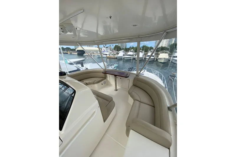 Cometa Yacht Photos Pics Luxurious 2012 Tiara Yachts 4800 Convertible with spacious seating, docked at marina.