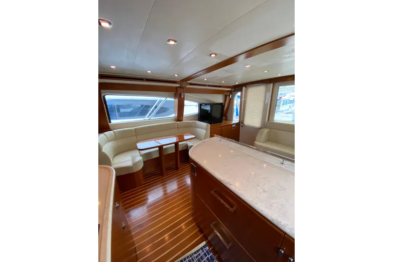 Cometa Yacht Photos Pics Luxurious interior of 2012 Tiara Yachts 4800 Convertible with elegant seating and modern design.