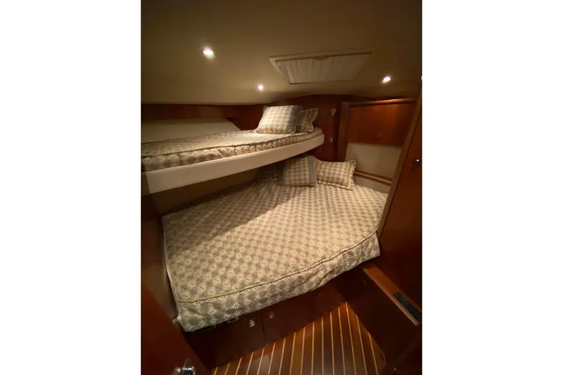 Cometa Yacht Photos Pics Interior cabin of 2012 Tiara Yachts 4800 Convertible with cozy bunk beds.