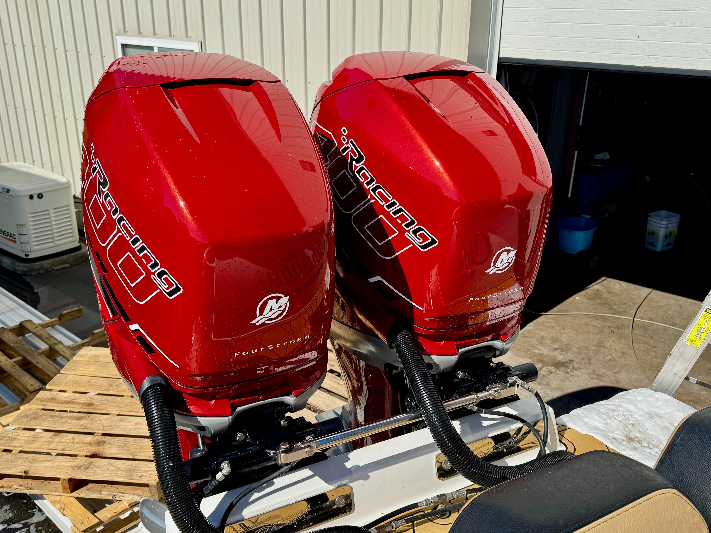 Red outboard engines on a 2019 Concept 36' Open Deck boat.
