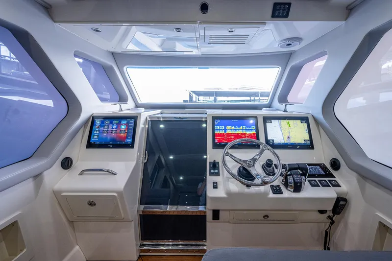 Mother Mary Yacht Photos Pics Modern cockpit of 2021 Gulf Crosser 52 yacht with advanced navigation systems.