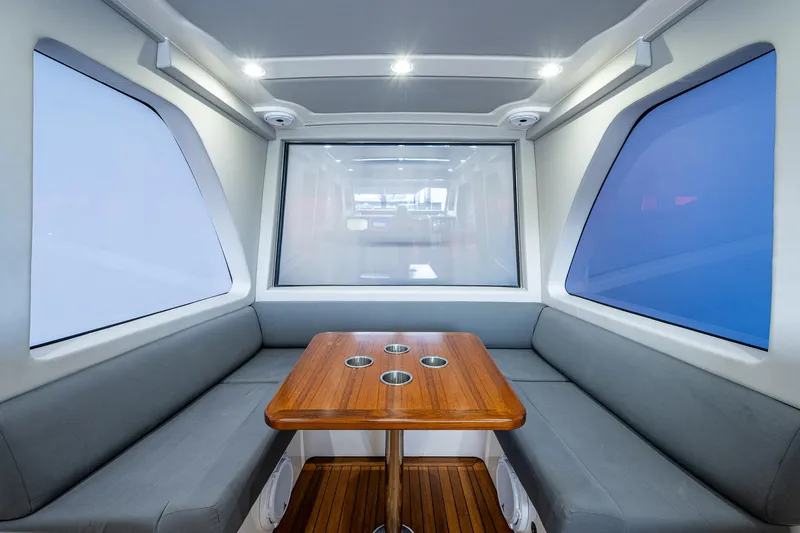 Mother Mary Yacht Photos Pics 2021 Gulf Crosser 52 interior with modern seating and wooden table.