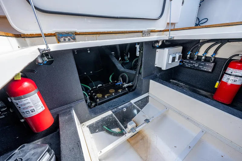 Mother Mary Yacht Photos Pics Engine compartment of a 2021 Gulf Crosser 52 boat with fire extinguishers.