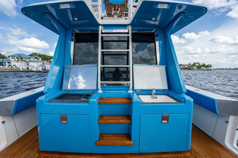 Mother Mary Yacht Photos Pics 2021 Gulf Crosser 52 yacht with blue exterior and onboard amenities.